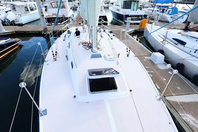 Slide: The Image of 2000 J Boats J/105 sailboat docked at marina, view of deck and rigging. - 8