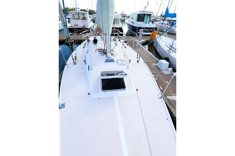 Slide: The Image of 2000 J Boats J/105 sailboat docked at marina, view of deck and mast. - 9