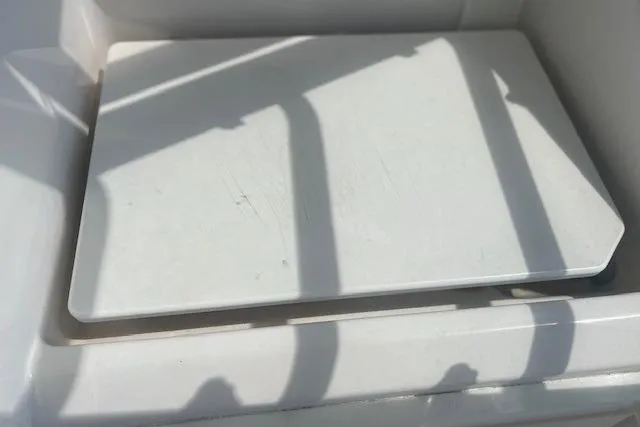 Slide: The Image of White surface on 2011 Everglades 350LX boat, with shadows cast across it. - 18