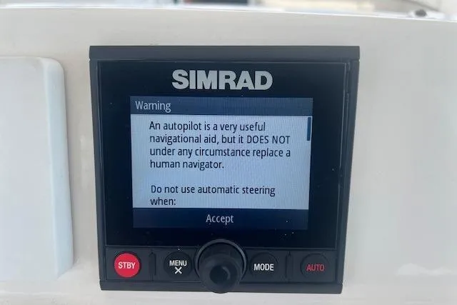 Slide: The Image of Simrad autopilot warning screen on 2011 Everglades 350LX, emphasizing human navigator importance. - 20