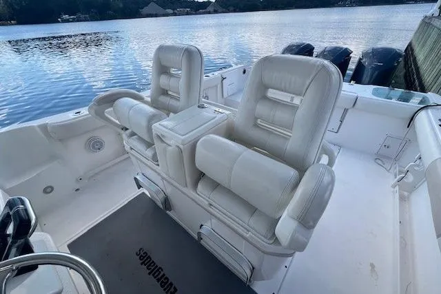 Slide: The Image of 2011 Everglades 350LX boat interior with white seating and water view. - 21