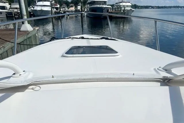 Slide: The Image of 2011 Everglades 350LX boat docked at marina, view from bow. - 23
