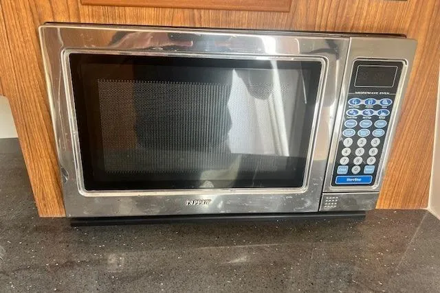 Slide: The Image of Stainless steel microwave oven on granite countertop, Everglades 350LX, 2011 model. - 25