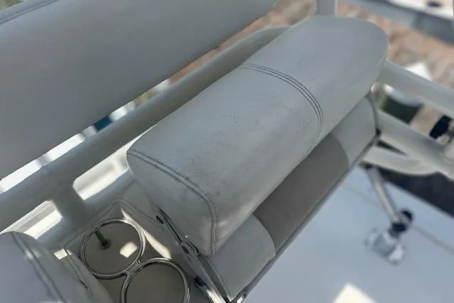 Slide: The Image of White leather seating on 2011 Everglades 350LX boat with cup holders. - 32