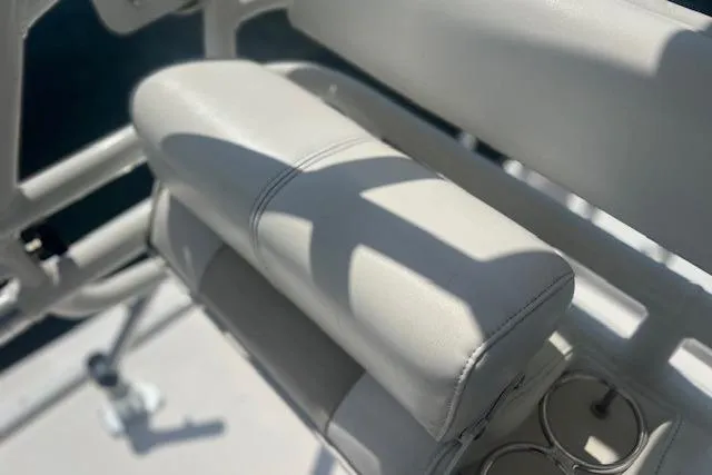 Slide: The Image of 2011 Everglades 350LX boat seat with cup holders, showcasing luxury marine design. - 33