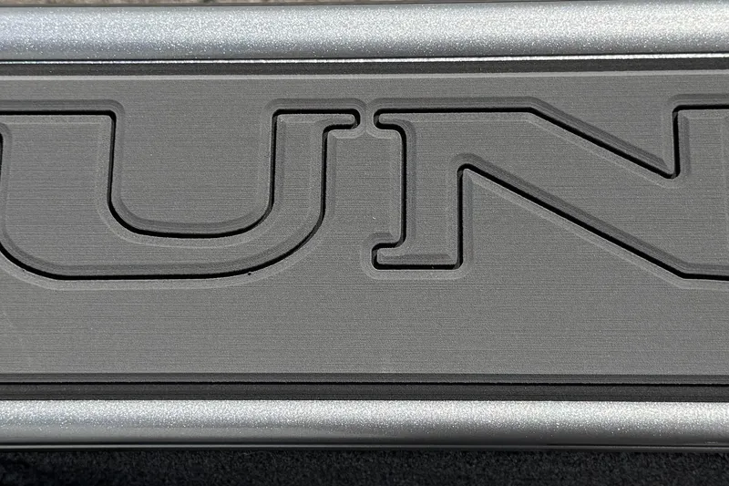 Slide: The Image of Close-up of Lund 1875 Fisherman 2026 logo in metallic finish. - 14