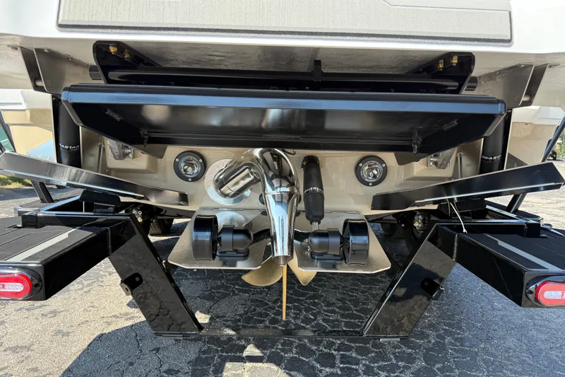 Slide: The Image of 2026 Supra SL 450 boat stern with propeller and trim tabs. - 12