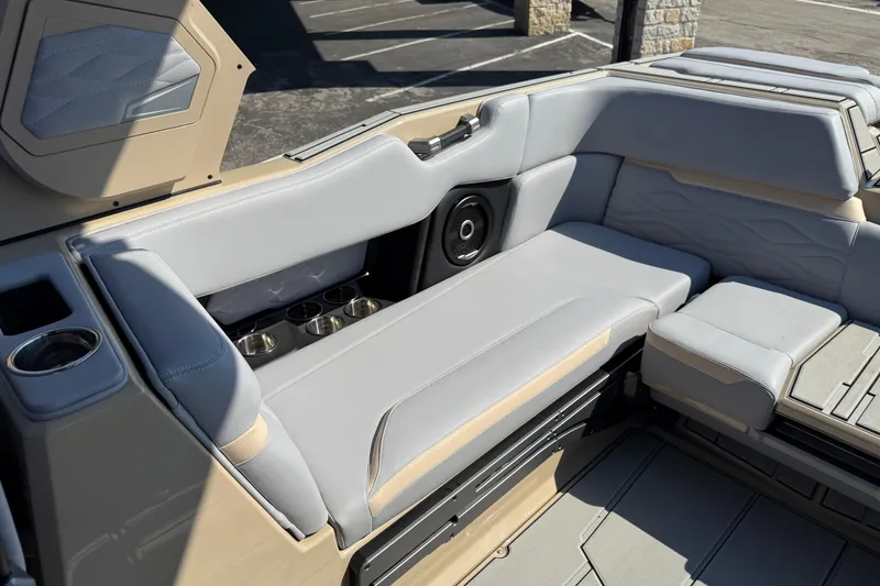 Slide: The Image of 2026 Supra SL 450 boat interior with luxurious seating and cup holders. - 29