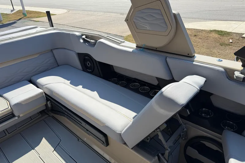 Slide: The Image of 2026 Supra SL 450 boat interior with luxurious seating and cup holders. - 30