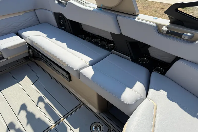 Slide: The Image of Luxurious interior seating of 2026 Supra SL 450 boat with cup holders and sleek design. - 31