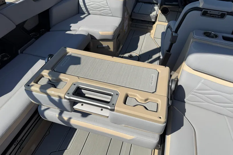 Slide: The Image of Interior of 2026 Supra SL 450 boat with luxurious seating and integrated storage. - 33