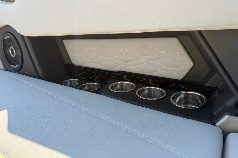 Slide: The Image of 2026 Supra SL 450 interior with cup holders and speaker detail. - 35