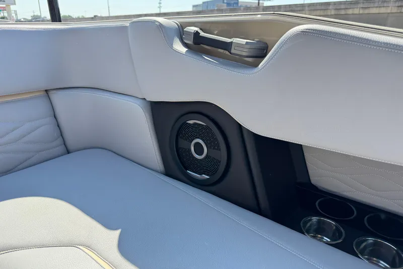 Slide: The Image of 2026 Supra SL 450 interior with premium speaker and cup holders. - 36