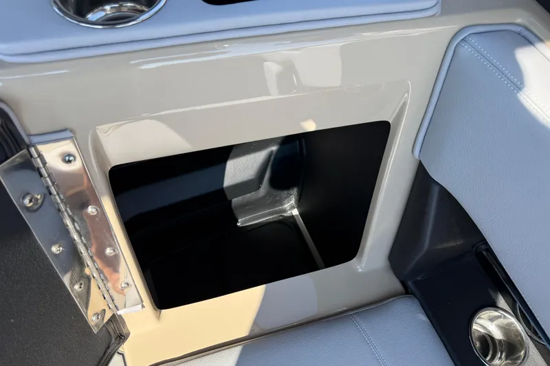 Slide: The Image of 2026 Supra SL 450 interior storage compartment with cup holder and sleek design. - 40