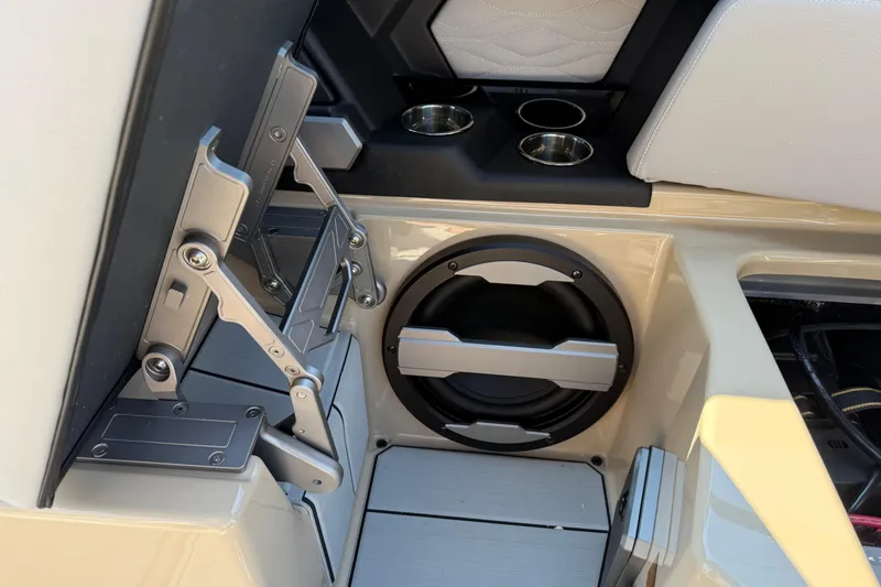 Slide: The Image of 2026 Supra SL 450 interior with cup holders and speaker system. - 47