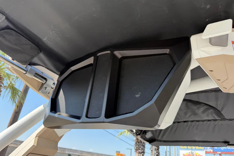 Slide: The Image of 2026 Supra SL 450 boat speaker system under canopy, sunny day. - 51