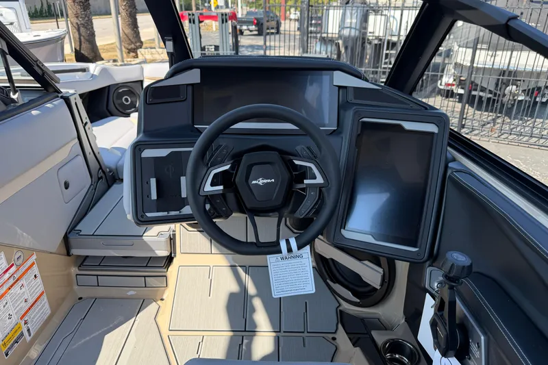 Slide: The Image of 2026 Supra SL 450 boat cockpit with modern steering and digital displays. - 56