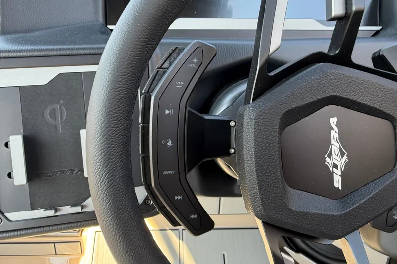 Slide: The Image of Steering wheel of 2026 Supra SL 450 with integrated controls and logo. - 60