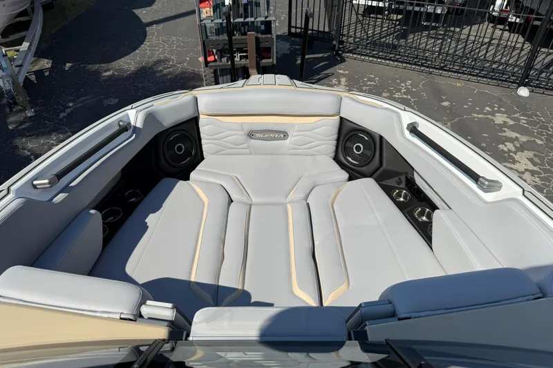 Slide: The Image of 2026 Supra SL 450 boat interior with luxurious seating and built-in speakers. - 69