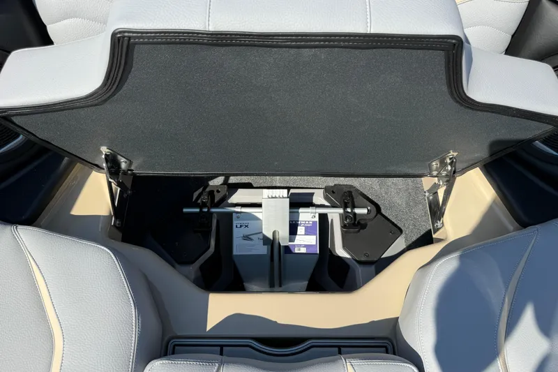 Slide: The Image of 2026 Supra SL 450 interior storage compartment with open lid, showcasing sleek design. - 71