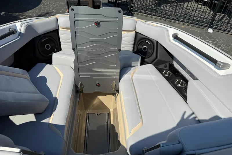 Slide: The Image of 2026 Supra SL 450 boat interior with gray seating and storage compartment. - 72