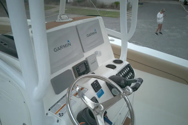 Slide: The Image of 2019 NauticStar 28 XS boat dashboard with Garmin navigation system. - 6