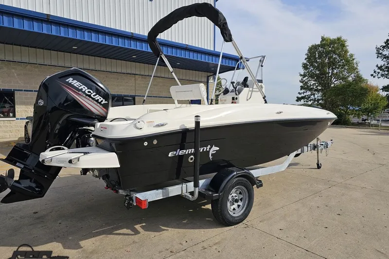 Slide: The Image of 2016 Bayliner Element F18 boat with Mercury engine on a trailer. - 14