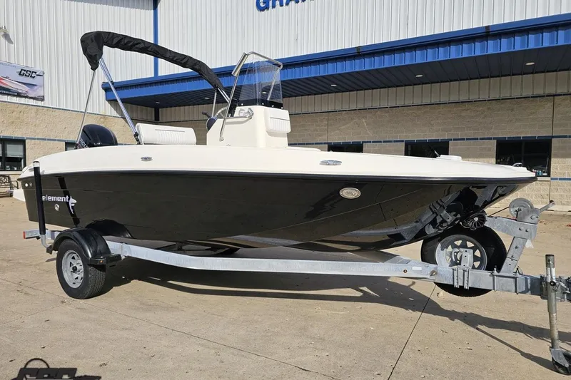 Slide: The Image of 2016 Bayliner Element F18 boat on trailer outside dealership. - 15