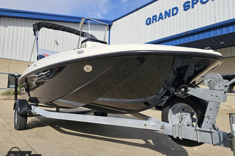 Slide: The Image of 2016 Bayliner Element F18 boat on trailer outside Grand Sport building. - 17