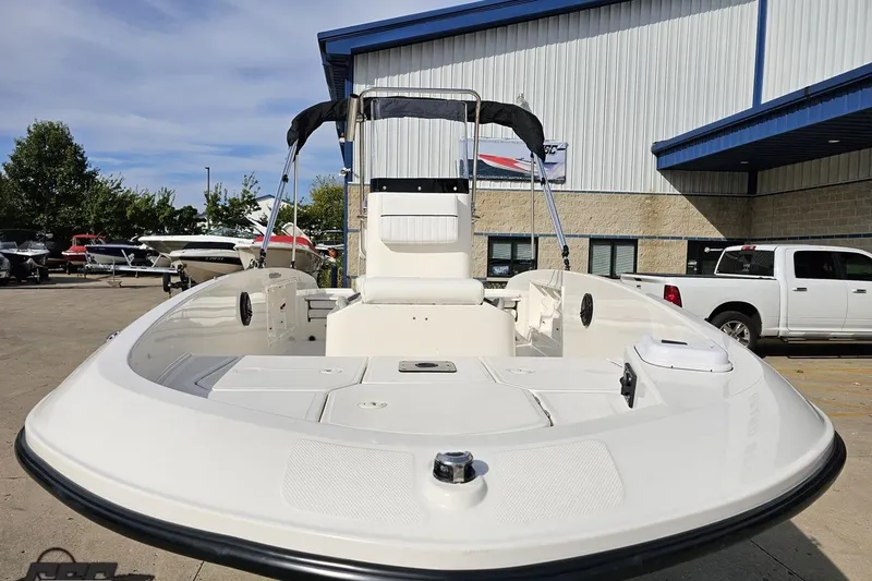 Slide: The Image of 2016 Bayliner Element F18 boat displayed outdoors at a dealership. - 20