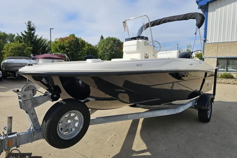 Slide: The Image of 2016 Bayliner Element F18 boat on trailer, parked outdoors. - 25