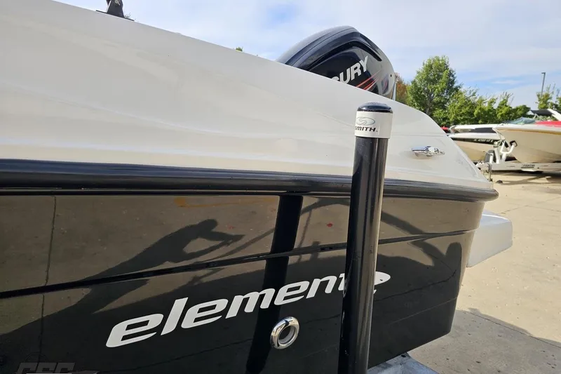 Slide: The Image of 2016 Bayliner Element F18 boat with Mercury engine, docked outdoors. - 31