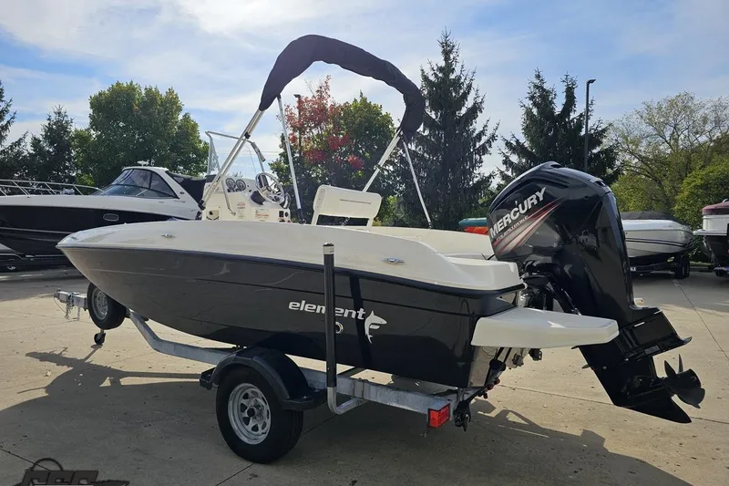 Slide: The Image of 2016 Bayliner Element F18 boat with Mercury outboard motor on trailer. - 34