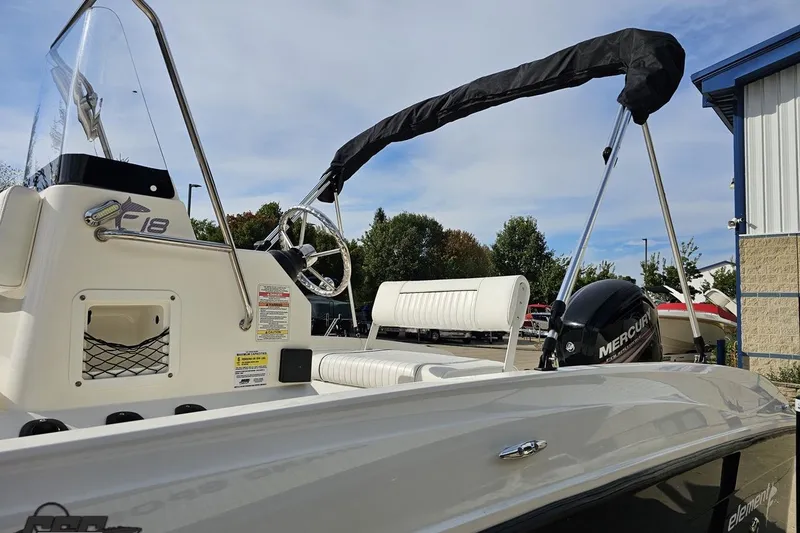 Slide: The Image of 2016 Bayliner Element F18 boat with Mercury engine, outdoor setting. - 35