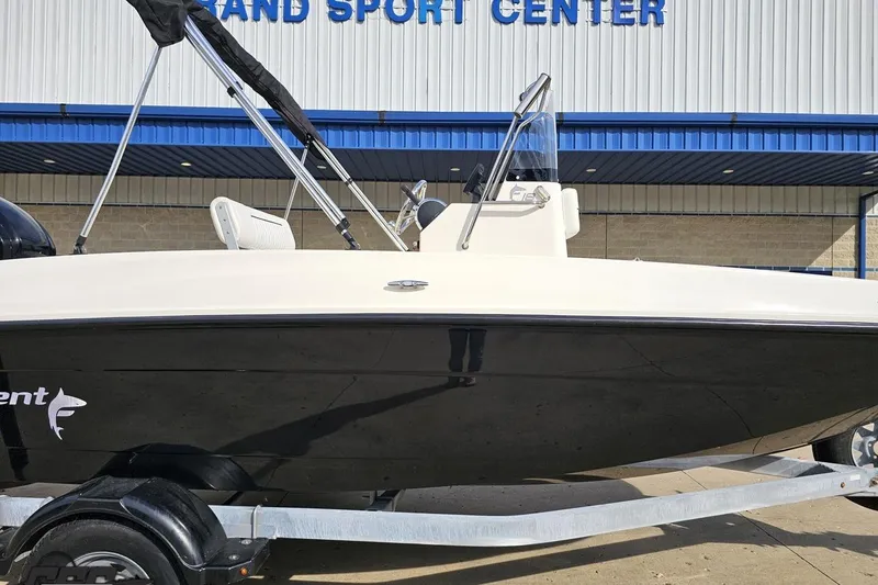 Slide: The Image of 2016 Bayliner Element F18 boat on trailer outside a sport center. - 4