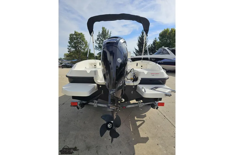Slide: The Image of 2016 Bayliner Element F18 boat rear view with outboard motor and canopy. - 41