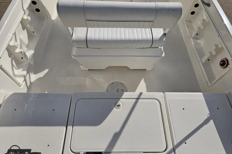 Slide: The Image of 2016 Bayliner Element F18 boat interior with seating and storage compartments. - 49