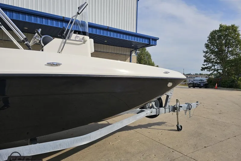 Slide: The Image of 2016 Bayliner Element F18 boat on trailer outside a building. - 5