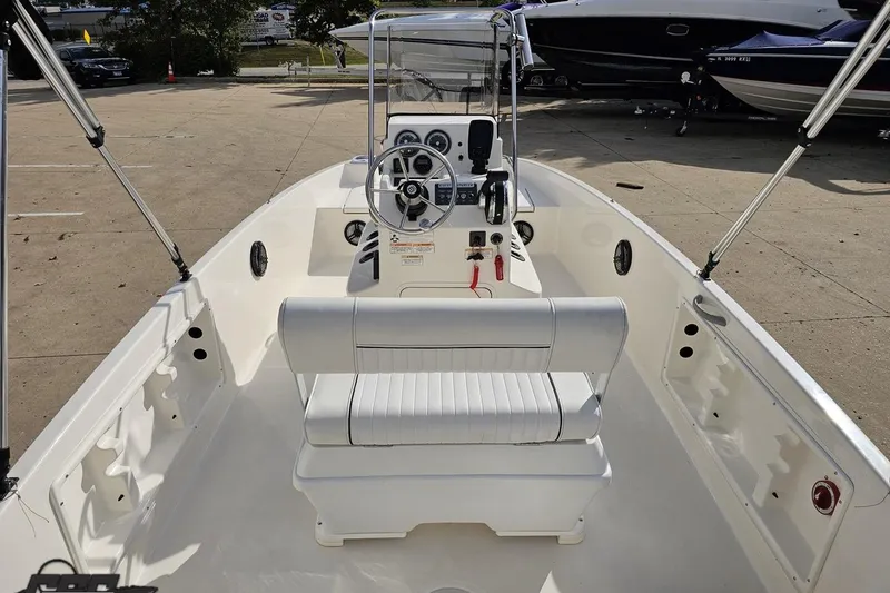Slide: The Image of 2016 Bayliner Element F18 boat interior with steering console and seating. - 50