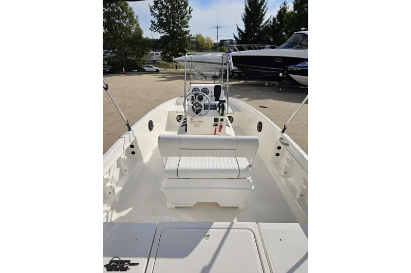 Slide: The Image of 2016 Bayliner Element F18 boat interior with steering console and seating. - 51