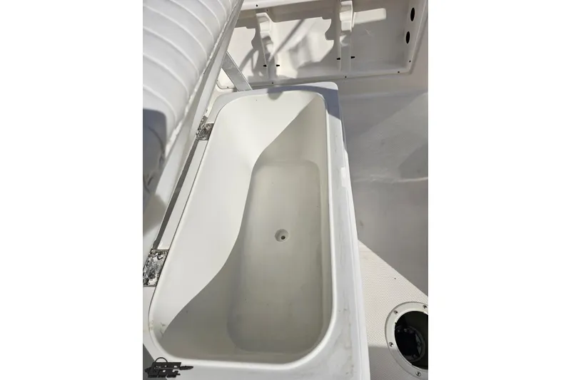 Slide: The Image of 2016 Bayliner Element F18 boat storage compartment, open and empty. - 65