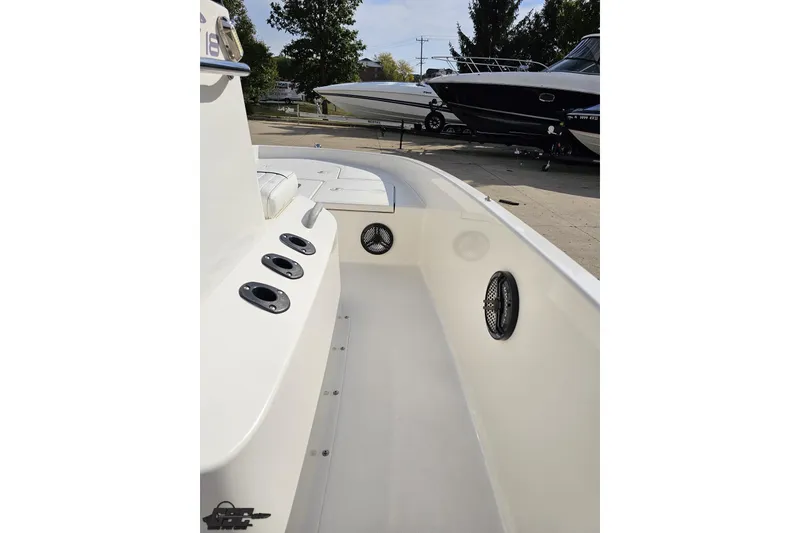 Slide: The Image of 2016 Bayliner Element F18 boat interior with rod holders and speakers. - 67