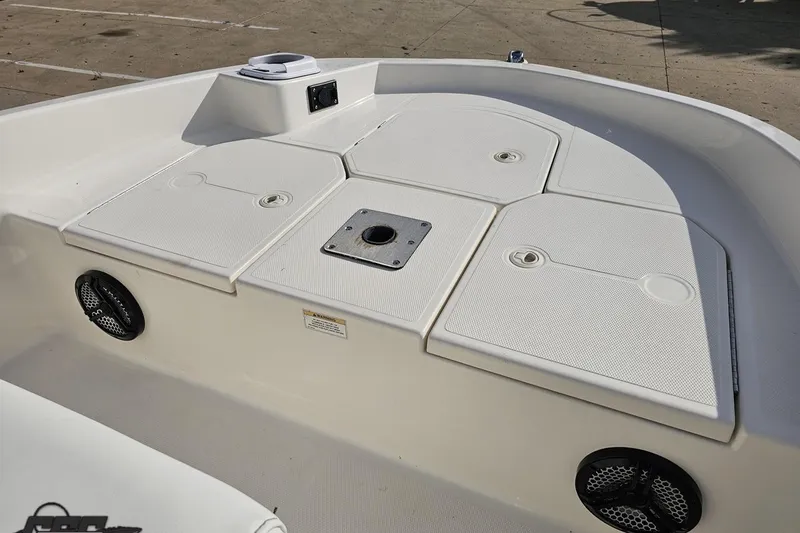 Slide: The Image of 2016 Bayliner Element F18 boat deck with storage compartments and speakers. - 69