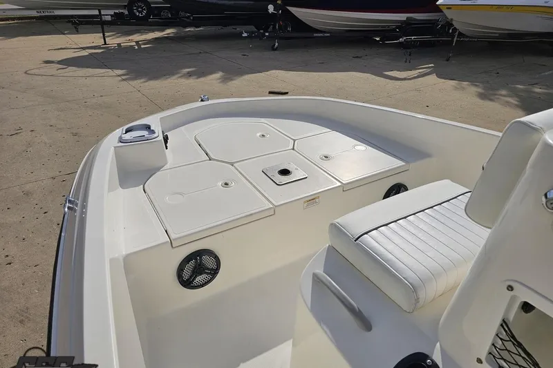 Slide: The Image of 2016 Bayliner Element F18 boat interior with seating and storage compartments. - 73