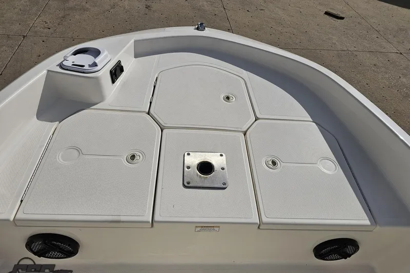 Slide: The Image of 2016 Bayliner Element F18 boat deck with storage compartments and fixtures. - 75