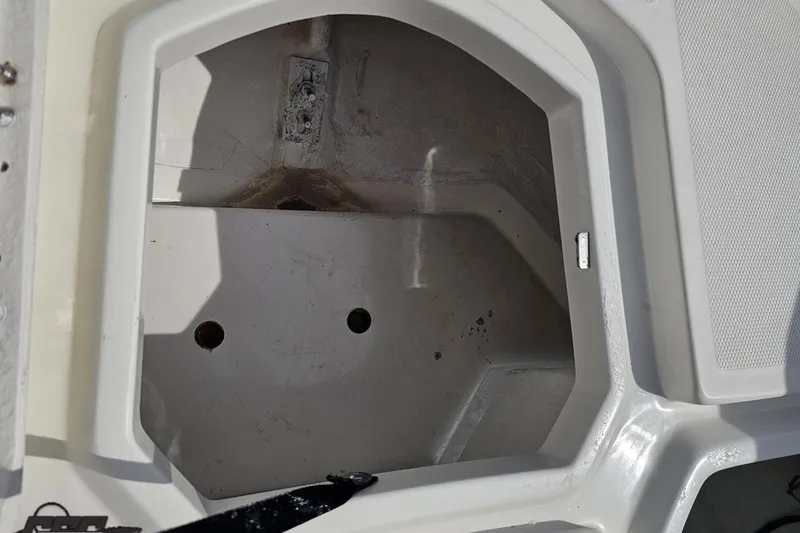 Slide: The Image of Open storage compartment on a 2016 Bayliner Element F18 boat. - 78