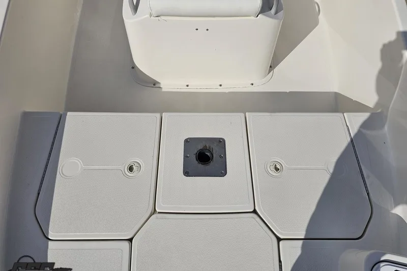 Slide: The Image of 2016 Bayliner Element F18 boat deck with storage compartments and seating area. - 83