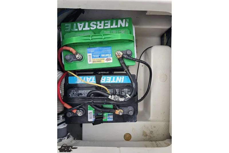 Slide: The Image of 2016 Bayliner Element F18 boat battery compartment with Interstate batteries. - 92