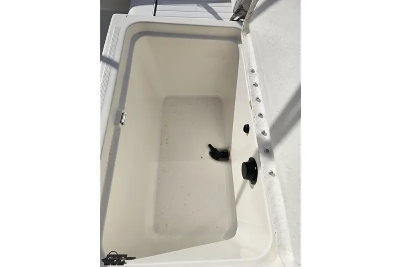 Slide: The Image of Open storage compartment on 2016 Bayliner Element F18 boat, showing interior details. - 95