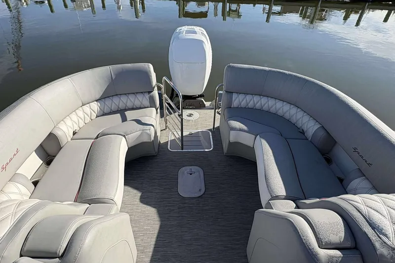 Slide: The Image of 2021 Bennington 27RX boat interior with luxurious seating and water view. - 10